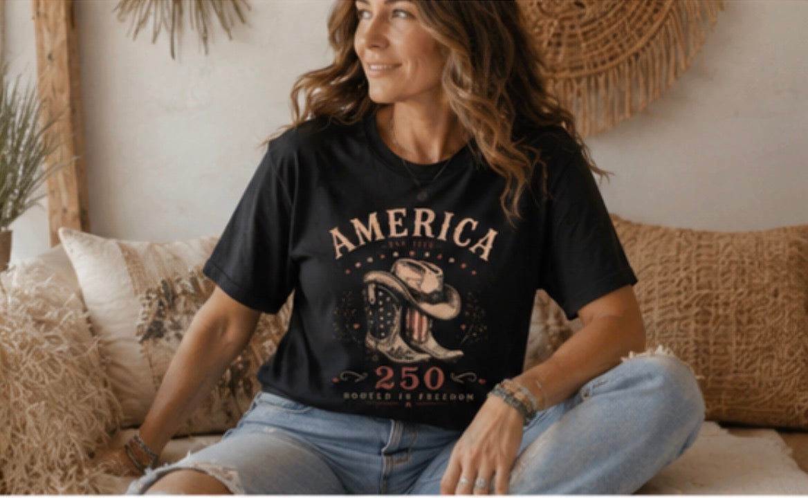 Women men wearing America 250 western inspired black T-shirt