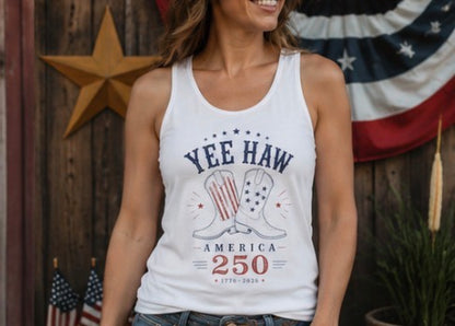 Woman wearing a white tank top with 'Yee Haw America 250' design in front of an American flag.