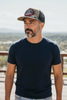 Man wearing America 250 Land of Liberty camo snapback hat outdoors — patriotic commemorative cap for July 4th 2026 semiquincentennial
