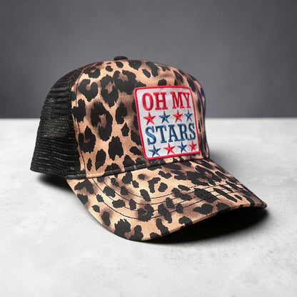 Leopard print cap with 'OH MY STARS' patch on a gray background