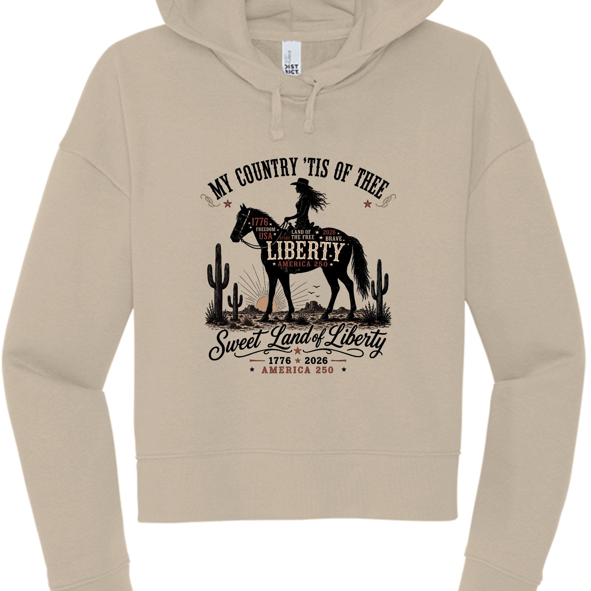 Women's tan patriotic cropped hoodie with vintage Western cowboy graphic reading My Country Tis of Thee Sweet Land of Liberty America 250 1776 2026
