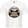 Women's white patriotic tee with vintage tattoo style circular graphic featuring golden eagle red roses gold rope border and America 250 Land of the Free 1776 to 2026 design
