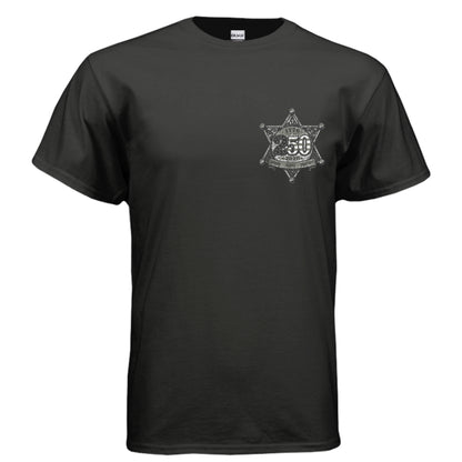 
Black t-shirt with Western Americana graphic — sheriff's star badge, "Celebrate America 1776–2026," and "Liberty • Unity • Freedom" in distressed silver lettering.