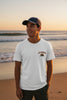 man standing on the beach wearing a california bear shirt 