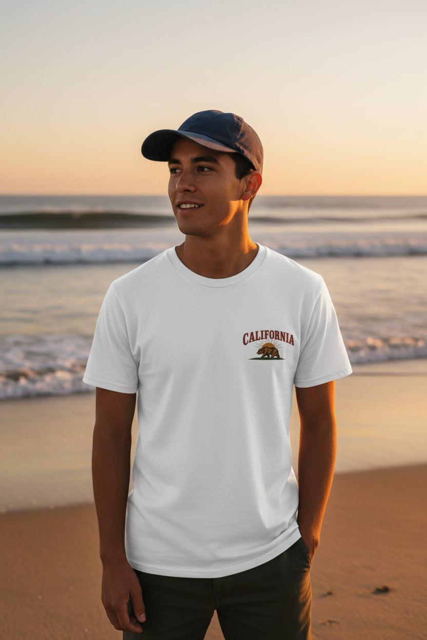 man standing on the beach wearing a california bear shirt 