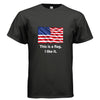 A black short-sleeve crewneck t-shirt featuring a graphic of the American flag with the text 'This is a flag. I like it.
