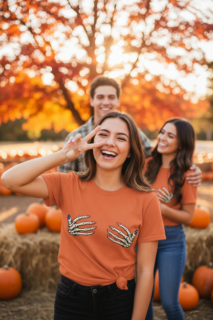 ORANGE -"Women wearing skull hands USA t-shirts at pumpkin patch"